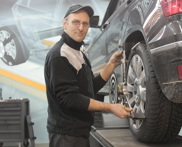Technician working on tyre